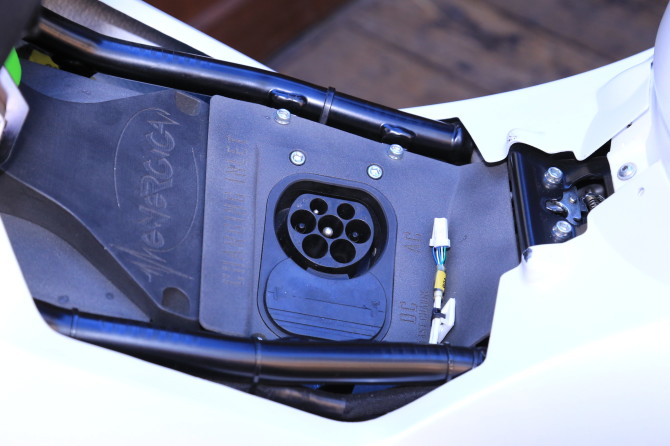 The charging port is under the seat, and it is designed for rapid charging.